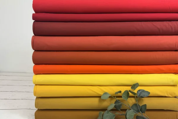 Jersey Stoff in Uni gelb, orange und rot Farben