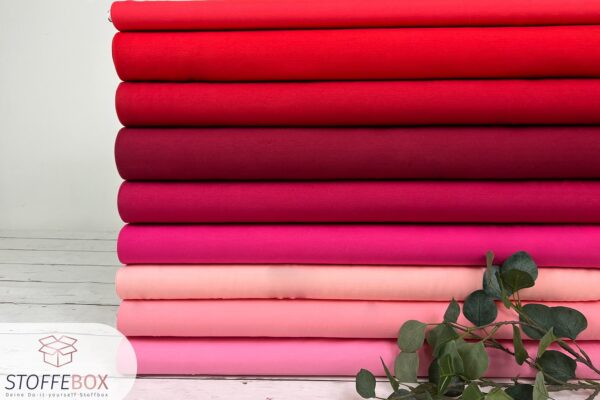 Kollage von Jersey Stoffen uni rosa und rot Farben