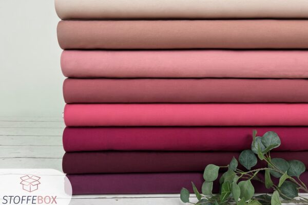 Kollage von Jersey Stoffen uni bordeaux und mauve Farben