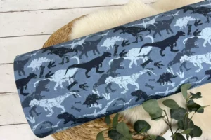 angerauter Jogger Stoff gemustert mit Dinosaurier Motiv in jeansblau