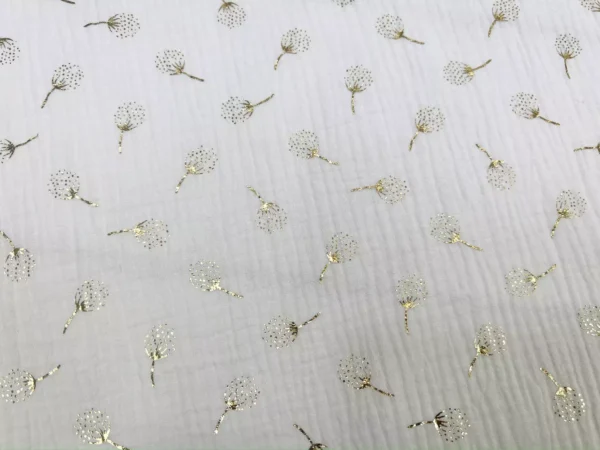 Musselin Stoff mit goldenen Pusteblumen in weiß