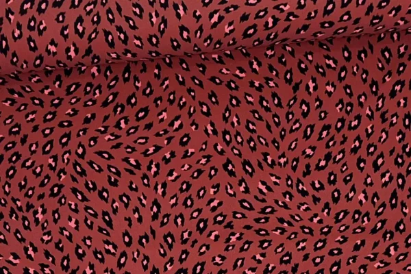 elastischer Lycra Funktionsjersey Stoff mit Leoprint Muster in rost