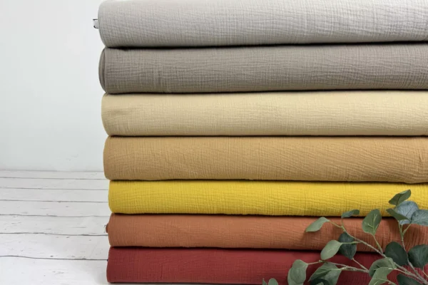 Musselin Stoff in den uni Farben gelb, rost, taupe, sand und beige