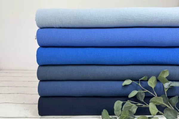 Musselin Stoff in den uni Farben blau, hellblau und dunkelblau